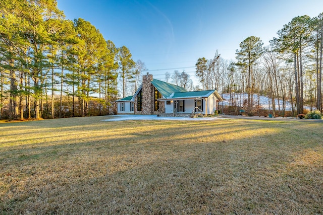 view of front of home featuring covered porch and a front yard