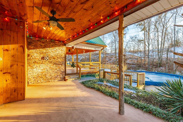 snow covered patio with ceiling fan