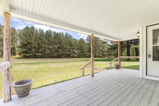 wooden deck with a lawn