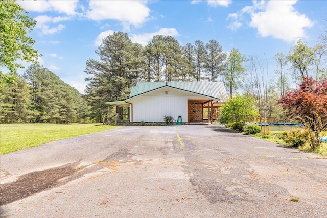 exterior space with a yard and driveway