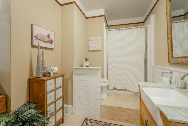 bathroom featuring toilet, tile patterned flooring, vanity, and curtained shower