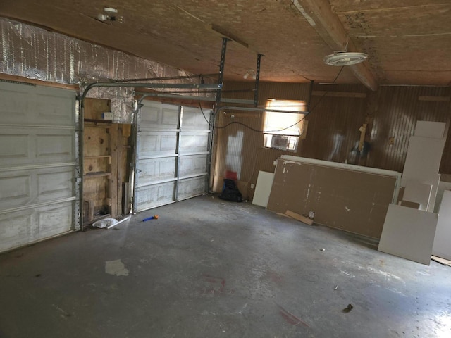 garage featuring wooden walls