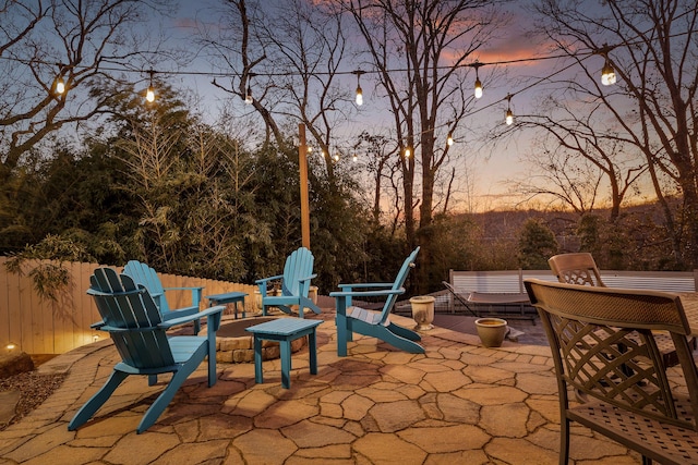 view of patio terrace at dusk