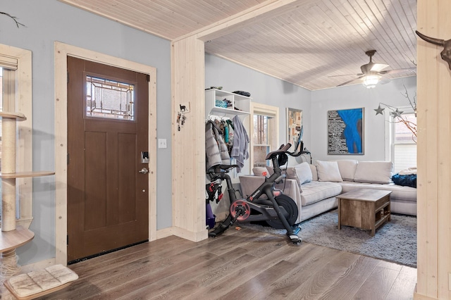 foyer entrance featuring a wealth of natural light, wooden ceiling, and hardwood / wood-style flooring