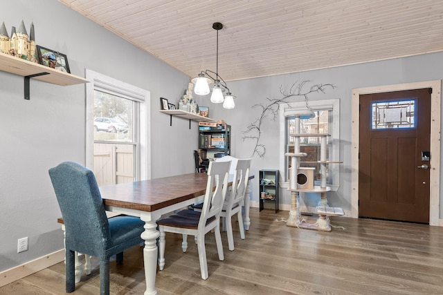 dining area featuring wooden ceiling and hardwood / wood-style flooring