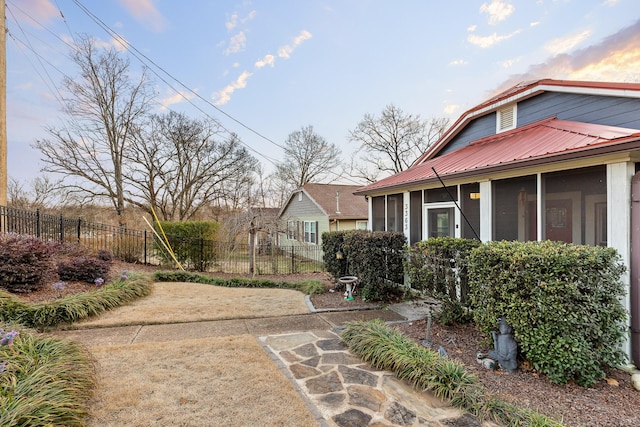 view of yard featuring a sunroom