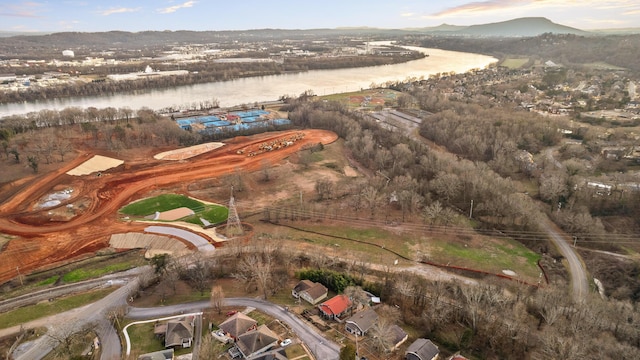 drone / aerial view with a water and mountain view