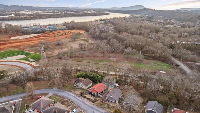 drone / aerial view featuring a water and mountain view