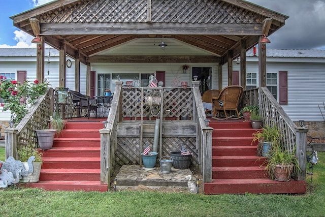 rear view of house featuring a porch