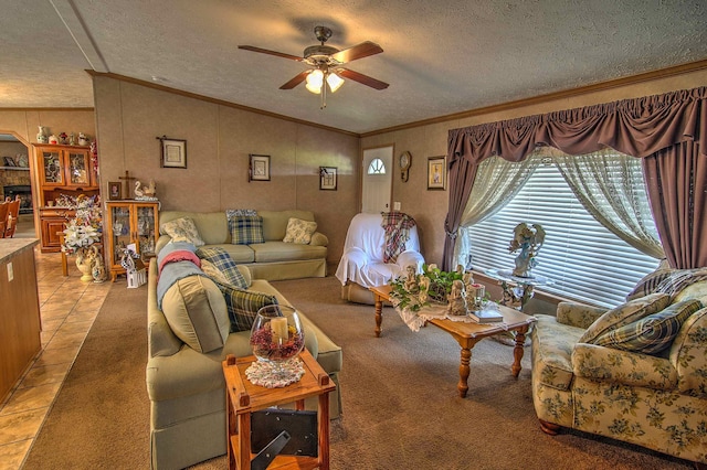 tiled living room with ceiling fan, crown molding, and a textured ceiling