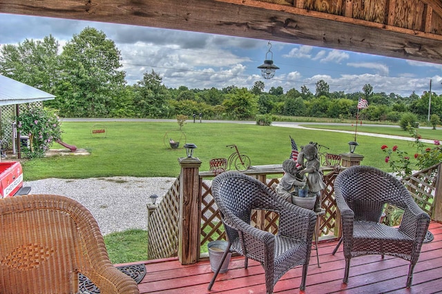 wooden deck featuring a yard