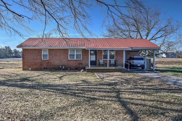 single story home featuring a carport