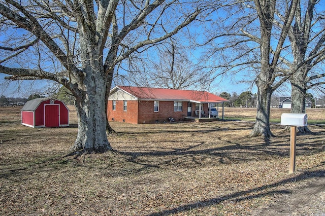 exterior space featuring a shed