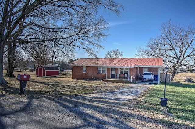 single story home featuring a shed