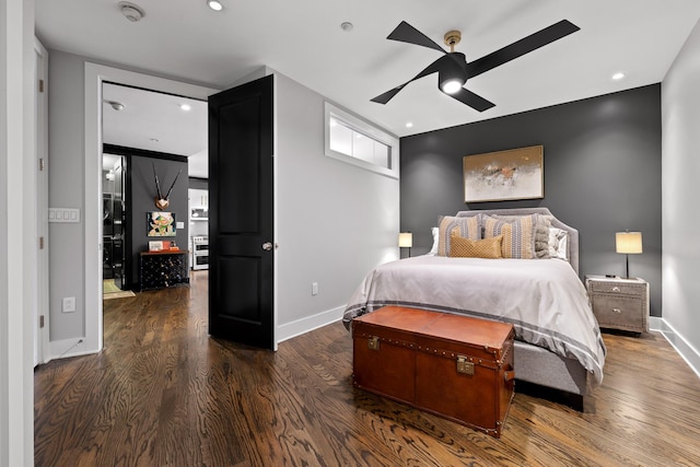 bedroom with ceiling fan and dark hardwood / wood-style flooring