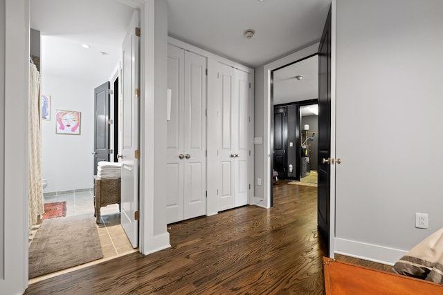 hallway featuring dark hardwood / wood-style floors