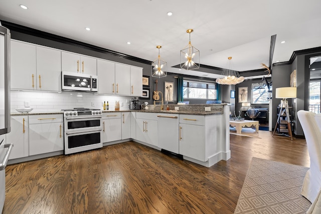 kitchen with white cabinetry, pendant lighting, and double oven range