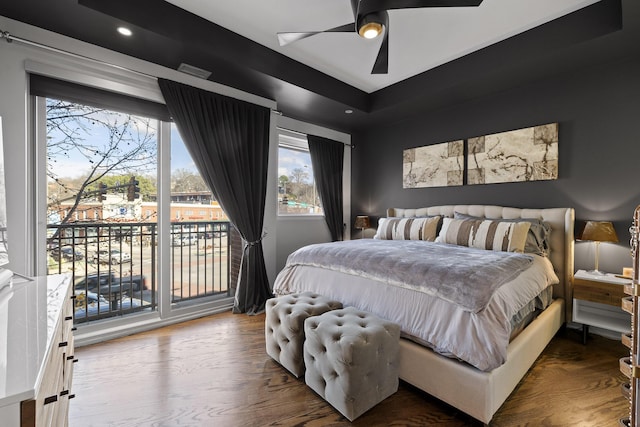 bedroom with access to exterior, hardwood / wood-style floors, and ceiling fan