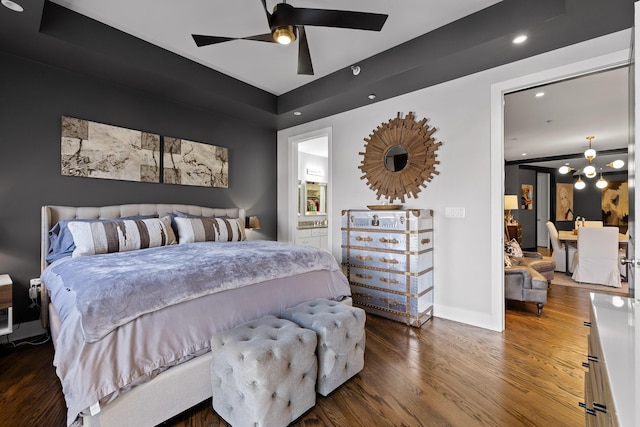 bedroom with dark hardwood / wood-style floors and ceiling fan