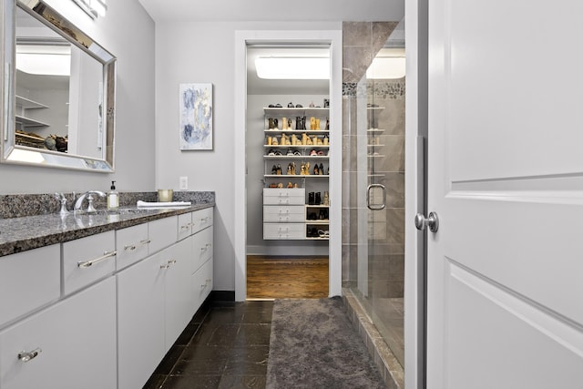 bathroom featuring vanity and walk in shower