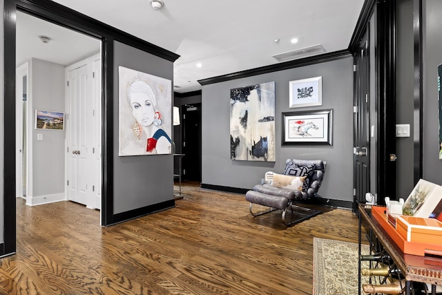 interior space featuring dark hardwood / wood-style flooring and crown molding