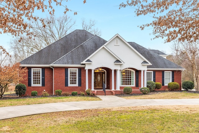 single story home featuring a front lawn