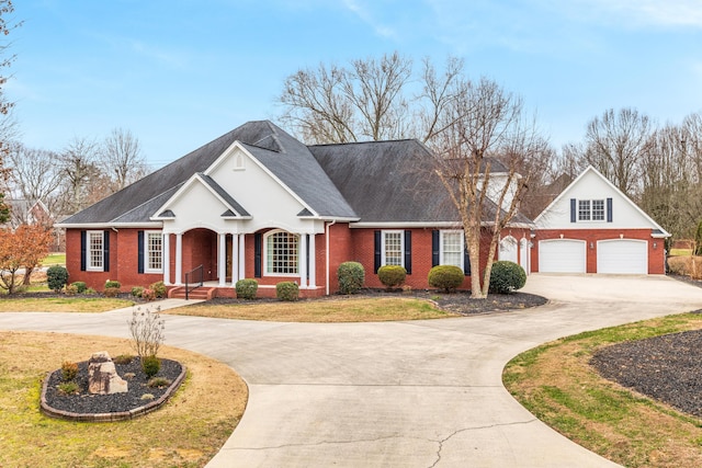 view of front of home featuring a front yard and a garage