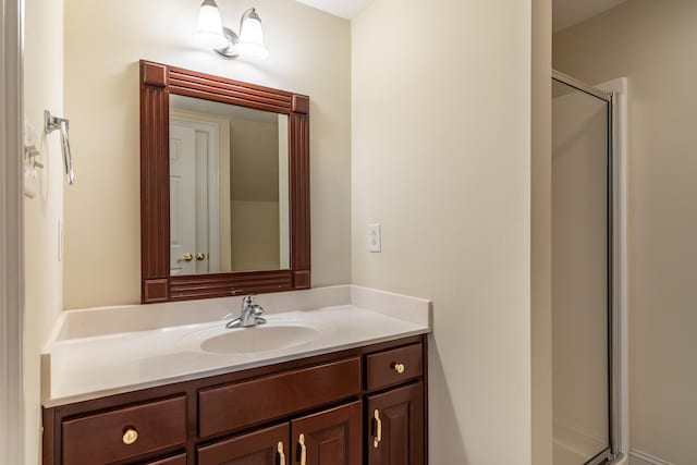 bathroom featuring vanity and an enclosed shower