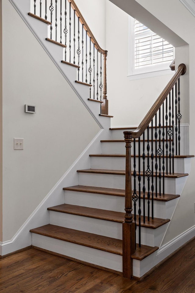 staircase featuring hardwood / wood-style floors