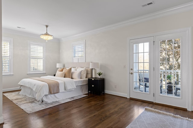 bedroom featuring multiple windows, access to outside, ornamental molding, and dark wood-type flooring