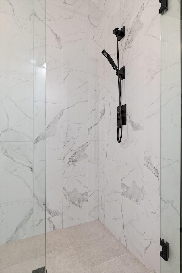 details featuring a tile shower