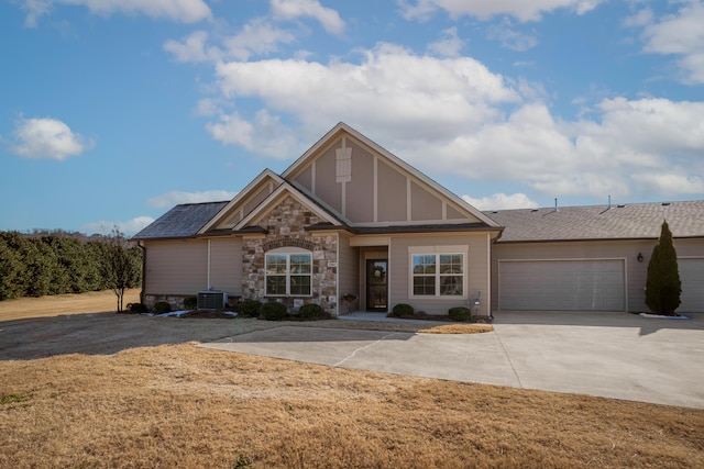 view of front facade featuring central AC, a front lawn, and a garage