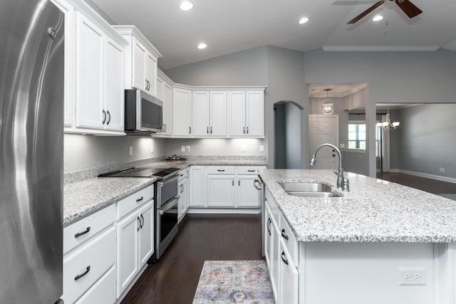 kitchen with sink, white cabinetry, ceiling fan with notable chandelier, a center island with sink, and appliances with stainless steel finishes