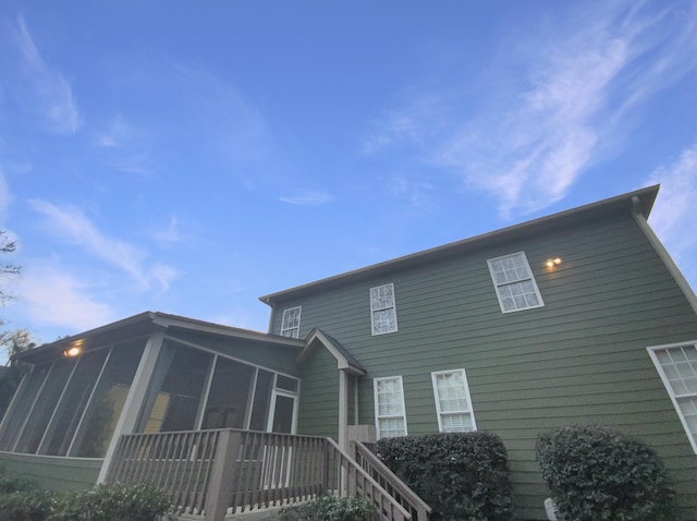 back of property featuring a sunroom