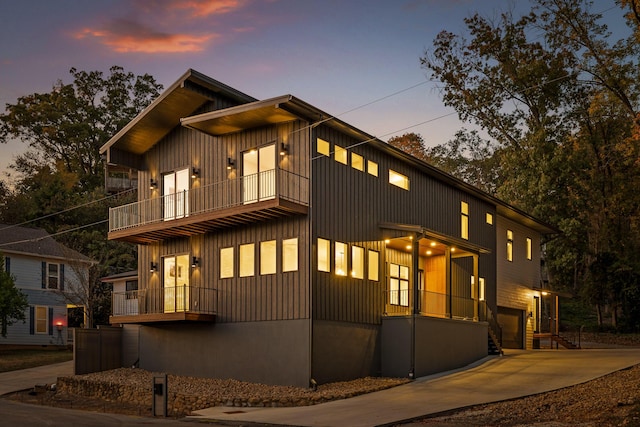 contemporary house with a balcony and a garage