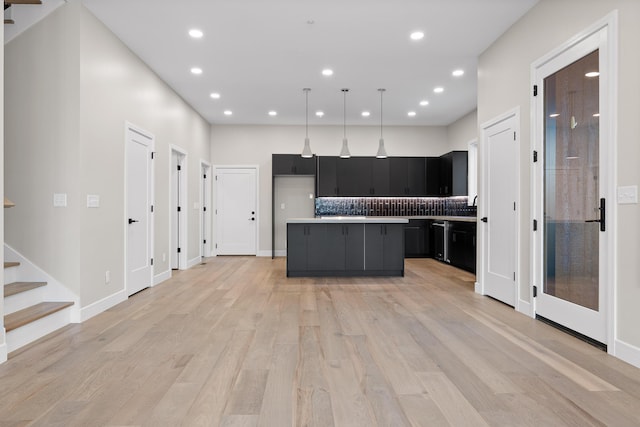 kitchen with light hardwood / wood-style floors, pendant lighting, and a center island