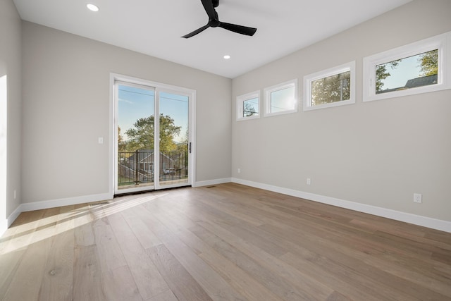 empty room featuring ceiling fan and light wood-type flooring