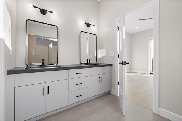 bathroom with tile patterned floors and vanity