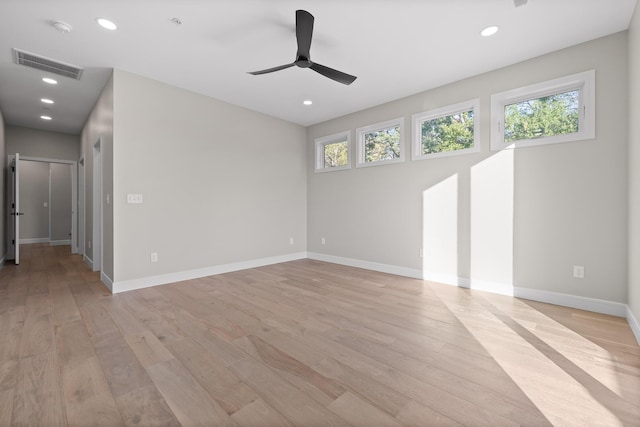 unfurnished room with ceiling fan and light hardwood / wood-style flooring