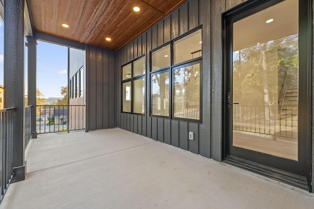 sunroom with wooden ceiling