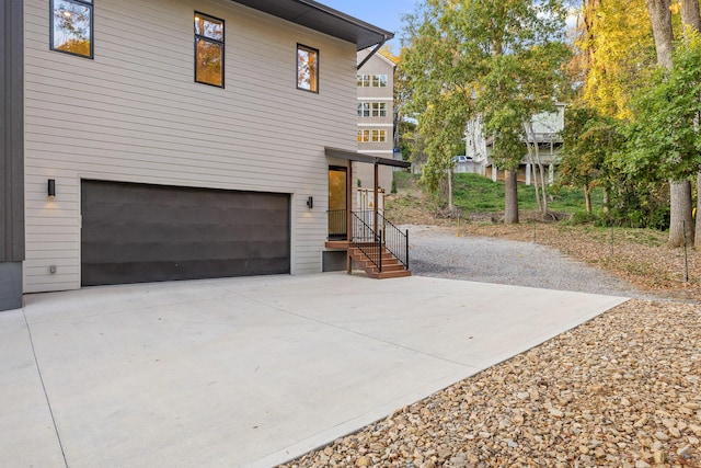 view of side of property featuring a garage