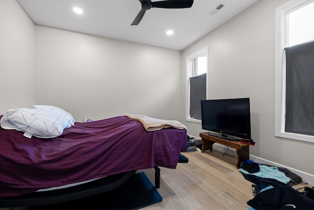 bedroom featuring ceiling fan and light hardwood / wood-style floors