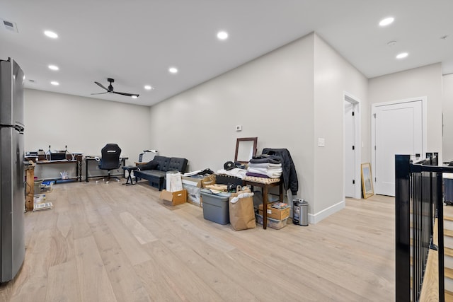 miscellaneous room with ceiling fan and light hardwood / wood-style flooring