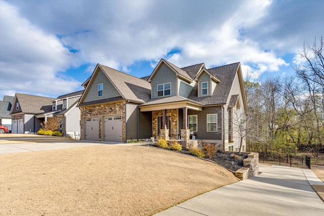 craftsman-style house featuring covered porch and a garage