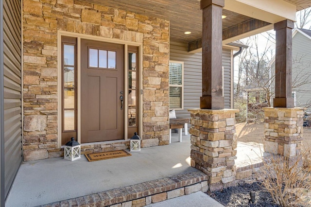 entrance to property featuring a porch