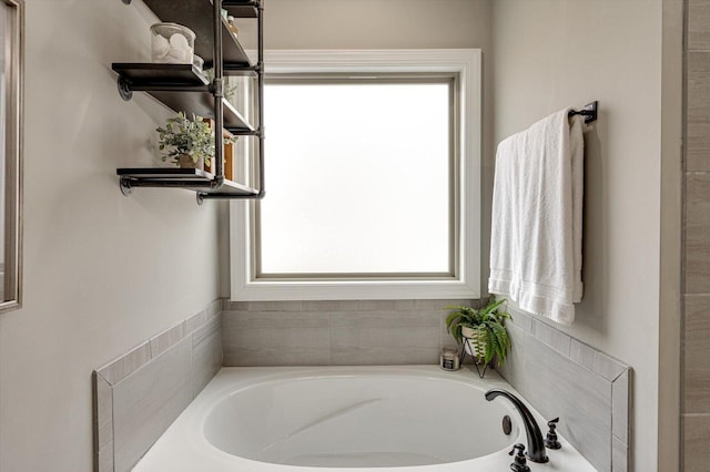 bathroom featuring a tub to relax in