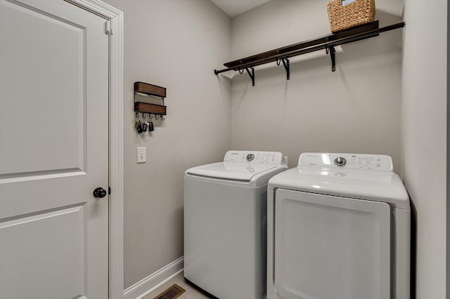 laundry room with washer and dryer