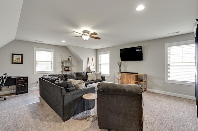 carpeted living room featuring vaulted ceiling, ceiling fan, and plenty of natural light