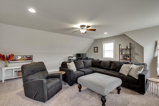 living room featuring ceiling fan, vaulted ceiling, and light colored carpet