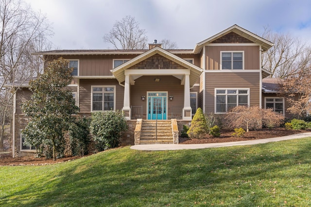 craftsman-style house with a front yard and a porch